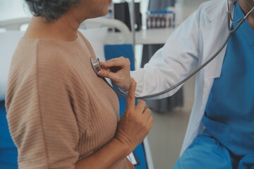 Doctor use stethoscope, checking up heart beat, lunch of auscultation in doctor office at hospital....