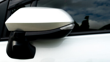 Luxury of Mirror wing color silver car keep from parking time. Parking of car outdoor with shardow in glass.