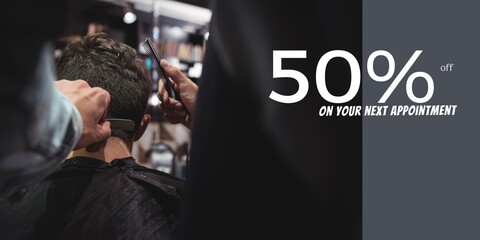 50 percent off text with diverse male client and male hairdresser cutting hair