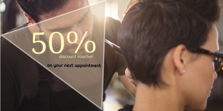 50 percent discount text with diverse female client and male hairdresser cutting hair - Powered by Adobe