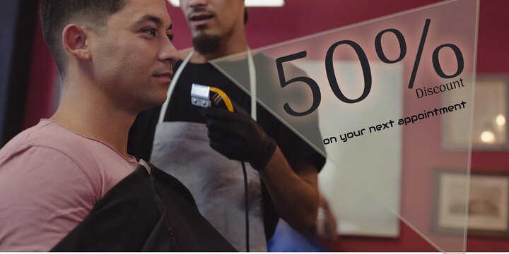 50 percent discount text with happy diverse male client and male barber shaving head