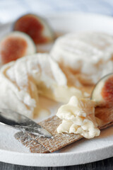 Goat cheese Coulommiers , brie, camembert from Russian farmers. Cheese is served with fruit