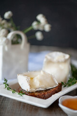 Goat cheese is useful from Russian farmers. Cheese is served with honey