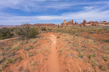 hiking the chesler park loop trail in the needles in canyonlands national park, usa