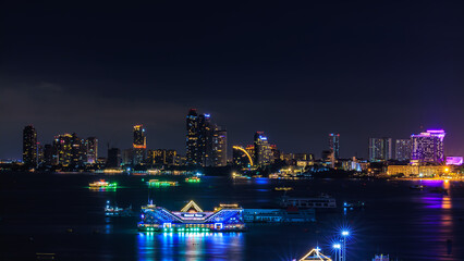 Cityscape over colors and the lights of pattaya and cruise ships in the sea, pattaya bay at night, Bali Hai View Point,