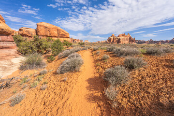 hiking the chesler park loop trail in the needles in canyonlands national park, usa