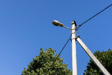 High-voltage power lines mounted on concrete poles