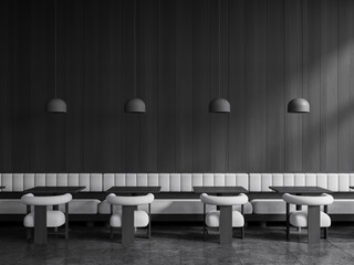 Dark cafe interior with armchairs and sofa, eating space with table and lamps