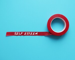 Red tape on blue background with handwritten text SELF ESTEEM,  subjective sense of overall...