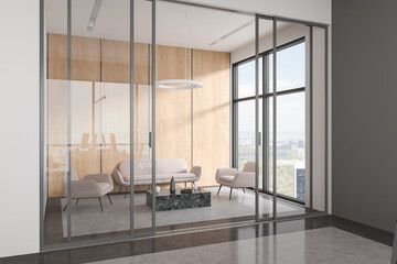 Relaxing zone in office interior with sofa and armchairs, panoramic window