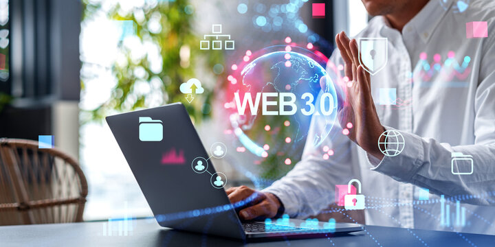 Man using laptop in office with web 3.0 hologram