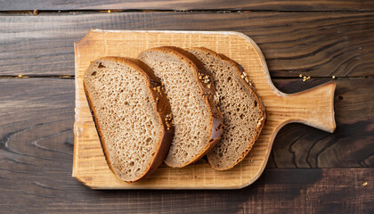 Sliced rye bread on a Board. On a wooden table. Top view
