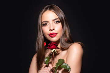 Beautiful woman face and flower. Girl and red rose. Close-up portrait, skin care, make-up. Valentines day. Holiday birthday day. No filter unaltered face.