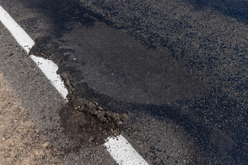 A damaged road dangerous for traffic