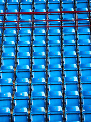 Naklejka premium Rows of blue seats in a stadium