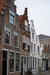 Fototapeta na wymiar Walking in old Dutch town Zierikzee with old small houses and streets, Zeeland, Netherlands