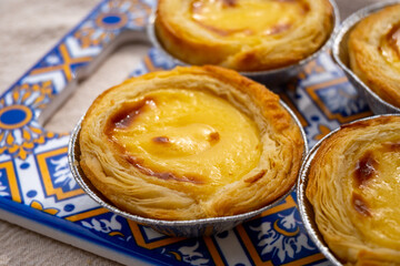 Portugal's traditional sweet dessert Pastel de nata egg custard tart pastry in cup