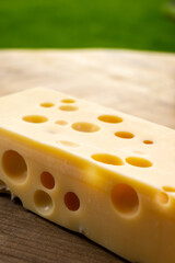 Cheese collection, french hard cheese with holes emmentaler close up