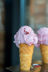 Fresh made italian ice cream on street in sunny day, summer vacation