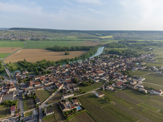 Panoramic aerial view on green premier cru champagne vineyards and fields near village Hautvillers and  Cumieres and Marne river valley, Champange, France