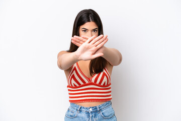 Young Brazilian woman isolated on white background making stop gesture with her hand to stop an act