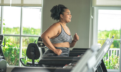 girl plus size women in sports bras walking and running on the treadmill weight loss and exercise...