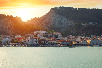 Sailing on the Ionian Sea, you can enjoy a beautiful view of the city of Zakynthos at sunset - 623716507
