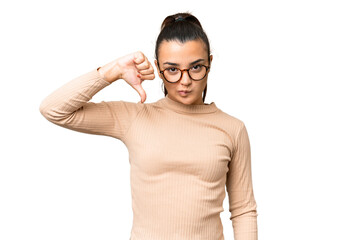 Young beauty woman over isolated chroma key background showing thumb down with negative expression