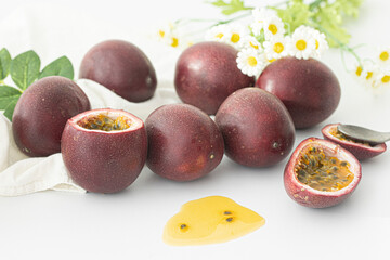 Fresh passion fruit slice and seeds isolated on white background.