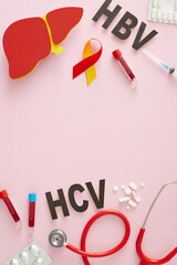 International Hepatitis Day. Top view vertical shot of tablets, HBV, HCV abbreviation, paper liver, stethoscope, blood samples, awareness ribbon, syringe on pink background with space for text