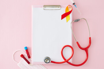 Prevention of hepatitis concept. Top-down view of clipboard organizer, stethoscope, awareness...