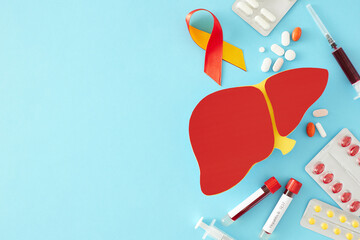 Health protection in the context of hepatitis. Top view photo of liver symbol, pills, blood samples, awareness ribbon, syringes on pastel blue background with empty space for text - obrazy, fototapety, plakaty