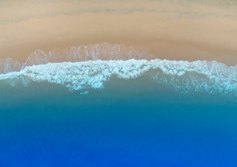 Beach Wave water in the Tropical summer beach with white sand beach background