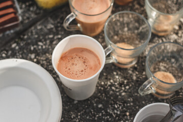 Desi Black Chai in glass mugs with traditional pakistani indian sweet
