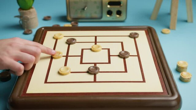 People challenge at Nine Men Morris Board Game