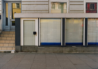 closed barber shop, closed and locked store front, impact of the coronavirus pandemic 2021. 