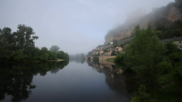 Mist on village of Beynac in Dordogne at sunrise