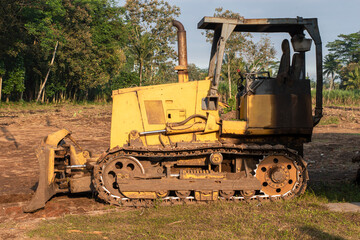 Fototapeta na wymiar Bulldozer at land clearing construction site