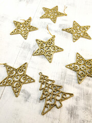 Background with gold Christmas tree decorations gold stars and Christmas tree