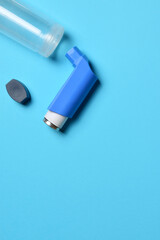 Inhaler and expanding tube for respiratory problems and diseases. Vertical shot and copy space, zenith view.