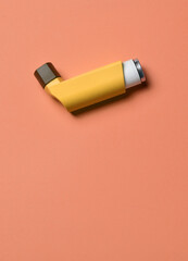 Inhaler for respiratory problems and diseases, vertical shot and copy space.