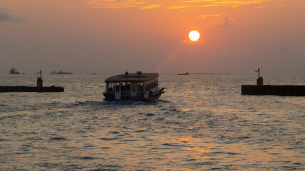 Fototapeta na wymiar MALDIVE SEAPORT AMAZING SUNSET 