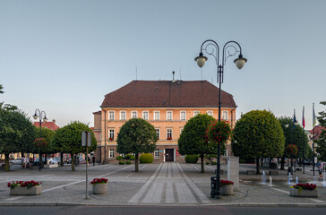 Town hall (Urząd miasta) at the old market square in  Pleszew, Wielkopolska, Poland - obrazy, fototapety, plakaty