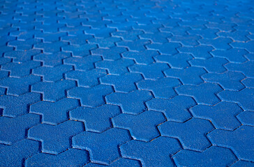 Paver brick floor, brick paving, paving stone or block paving. Manufactured from concrete or stone for road, path, driveway and patio. Empty floor in perspective view selective focus