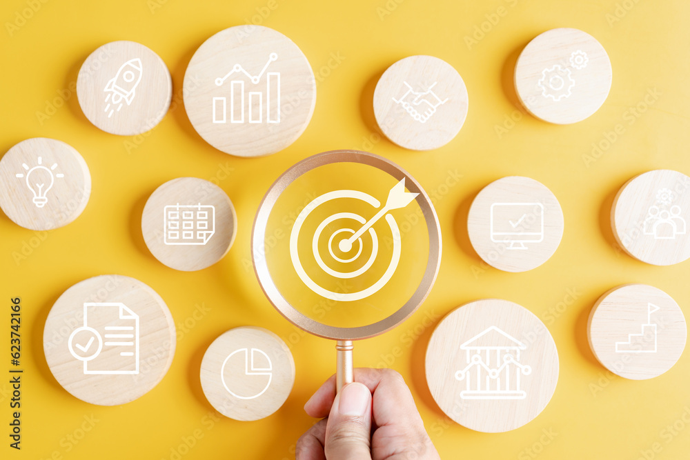 Leinwandbilder Magnifier glass focus to target objective with business icons. planning development leadership and customer target group concept...