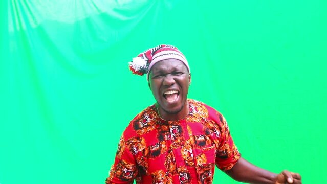Energetic jubilation of Male Igbo tribe businessman from Africa with fist pumps, thumbs up and screaming Yes