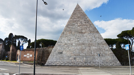 Ancient Pyramide Cestia and its architecture in white marble the famous sepulcher building at 12 A.C. houses the tomb of Caio Cestio Epulone it's located in Rome