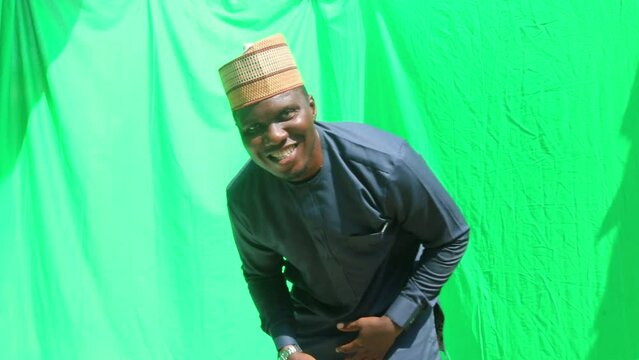 Modern business African man turns on a selfie camera, steps back and dance to celebrate a successful deal