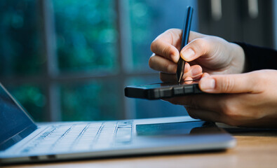 close up hands multitasking man using tablet, laptop and cellphone connecting wifi