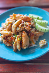 Thai fried crab in basil sauce serve with jasmine steam rice on blue dish in Restaurant, Thailand street food